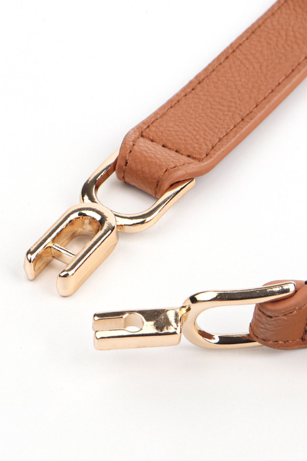 Caramel elasticated hook-clasp waist belt with gold-tone alloy hardware.