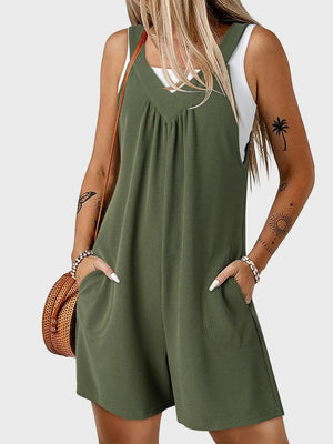 Moss green textured romper with V-neck, gathered yoke, and pockets.