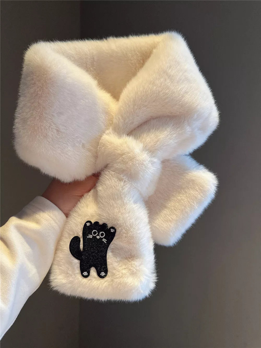 Cream plush scarf with black cat embroidery detail