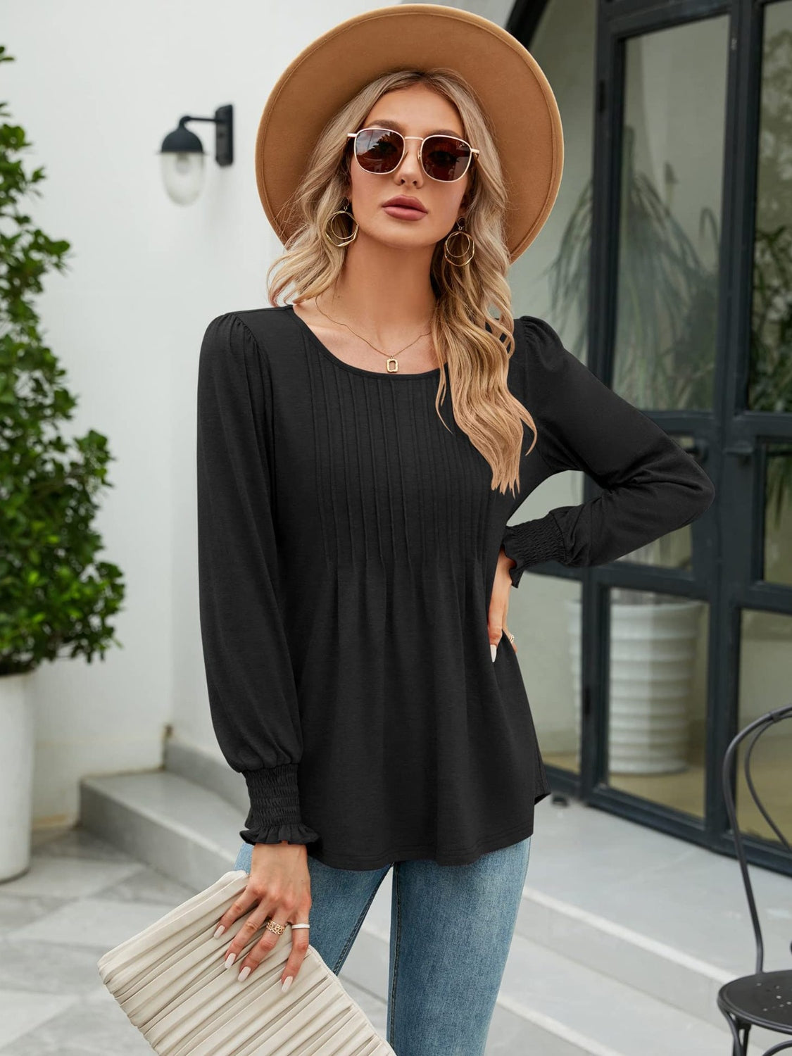 Black long sleeve blouse with pleated bodice and gathered cuffs