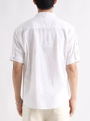 White cotton button-down shirt with rolled sleeves and mandarin collar.