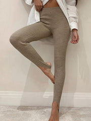 Camel ribbed knit stirrup leggings with a high waist and split ankle detail.