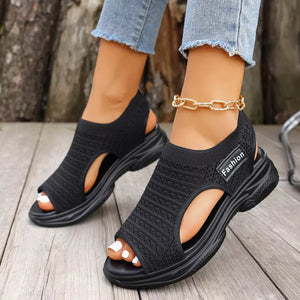 Black sporty chunky platform sandals with breathable knit upper and "Fashion" detail.