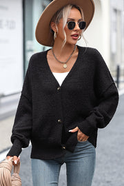 Black textured bouclé button-down cardigan with V-neck and long sleeves.