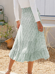 Asymmetric wrap skirt in Gum Leaf with a delicate leaf print and ruffled hem.
