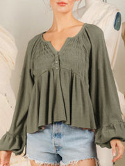 Textured ribbed peplum blouse in matcha green with button front and ruffled cuffs