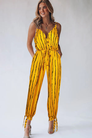 Gold striped wrap jumpsuit with tie ankles and V-neckline.
