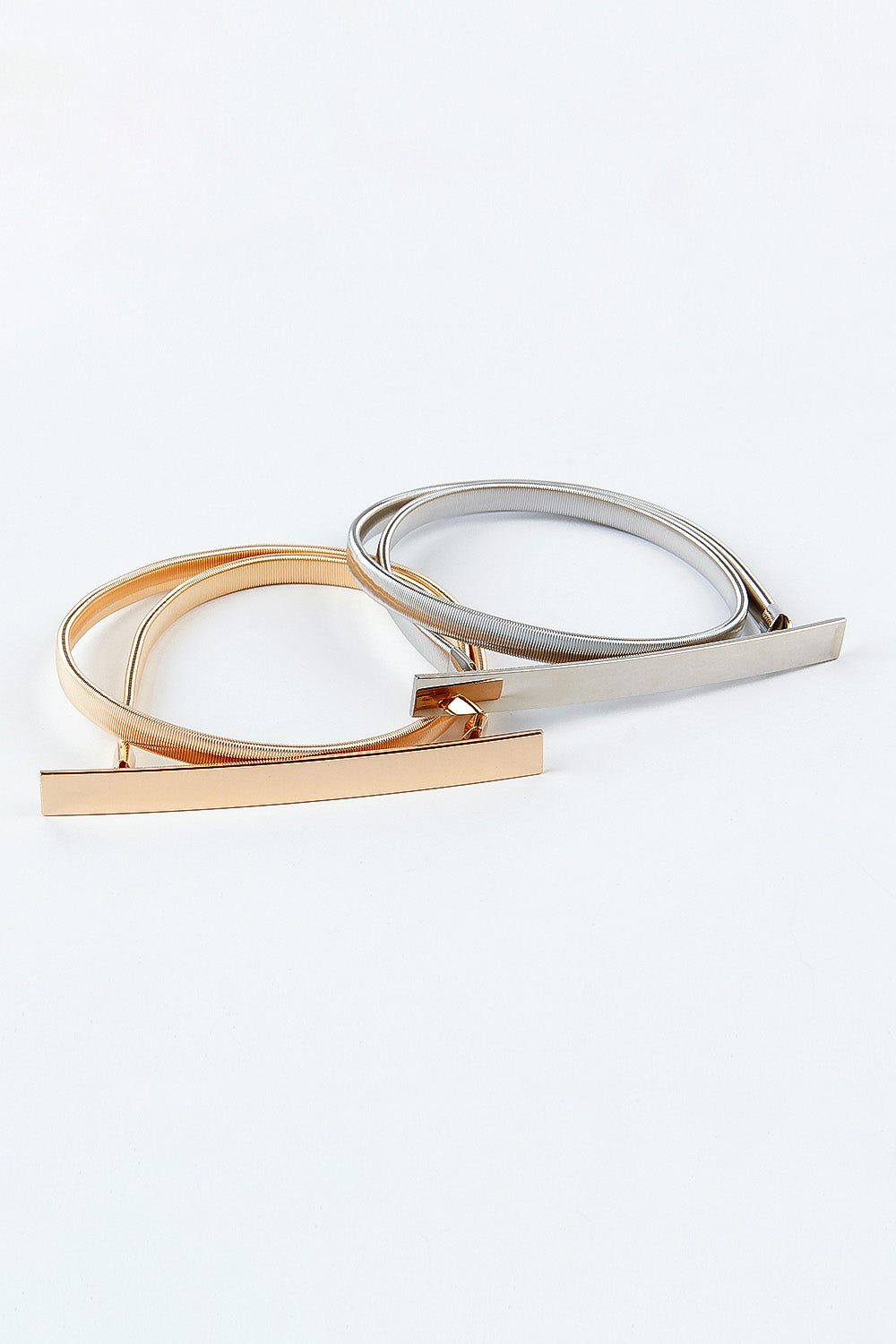 Slimline gold and silver metal elastic belts with rectangular buckle detail