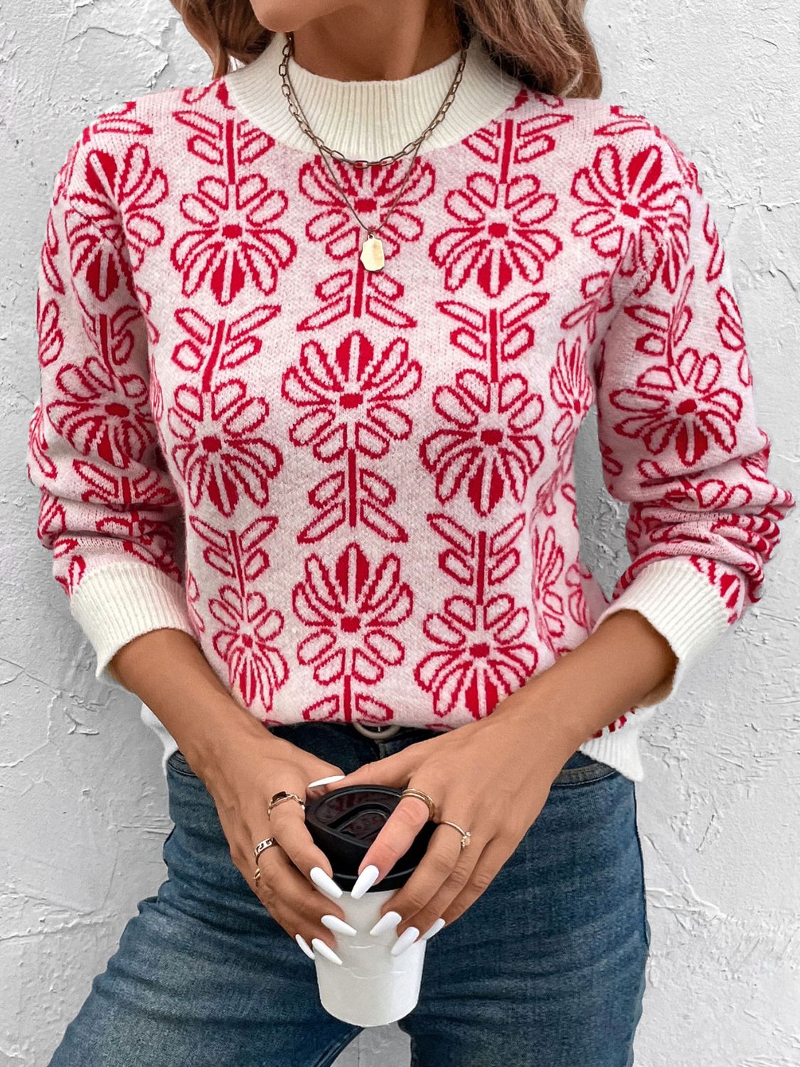 Intarsia floral crewneck knit sweater in scarlet and white acrylic with ribbed cuffs and neckline.