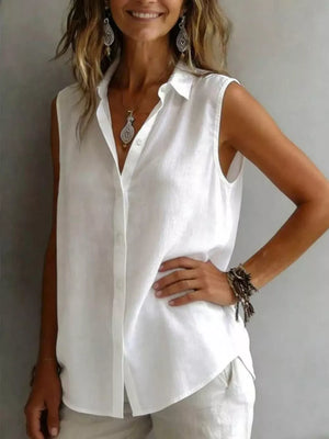 White sleeveless button-up shirt with collar and button closure.