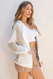 White waffle knit hoodie with quilted panels and elbow patches.
