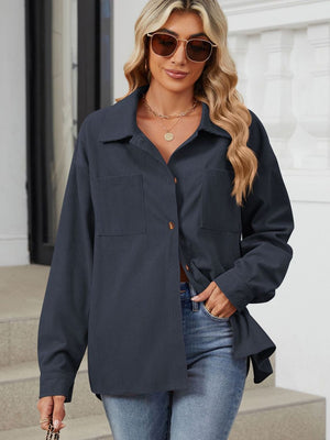 Dark Navy corduroy overshirt with patch pockets and button front, worn open over jeans.