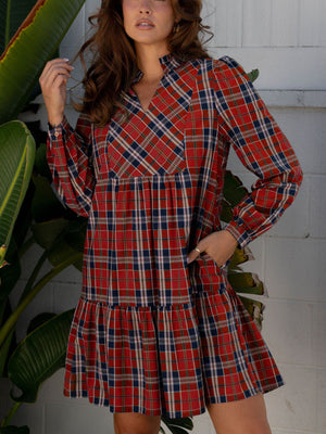 Red tartan mini dress with frilly collar, button-down front, and tiered skirt.