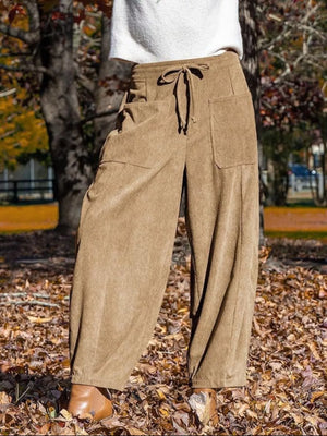 Brown corduroy wide-leg pants with drawstring waist and pockets