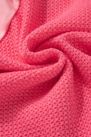 Blush pink waffle knit shacket with textured fabric detail.