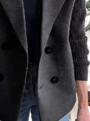 Gray double-breasted wool blend blazer with black buttons and ribbed sleeves.