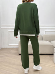 Army green knit lounge set with ribbed trim detail on sweater hem and cuffs.