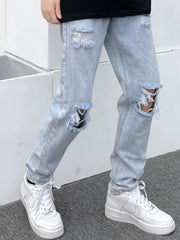 Light blue distressed slim fit 100% cotton jeans with ripped knees and frayed hems.