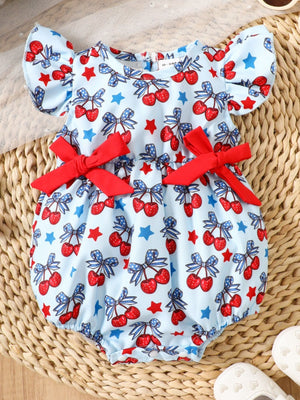 Baby one-piece with cherry print, ruffle sleeves, and red bows.