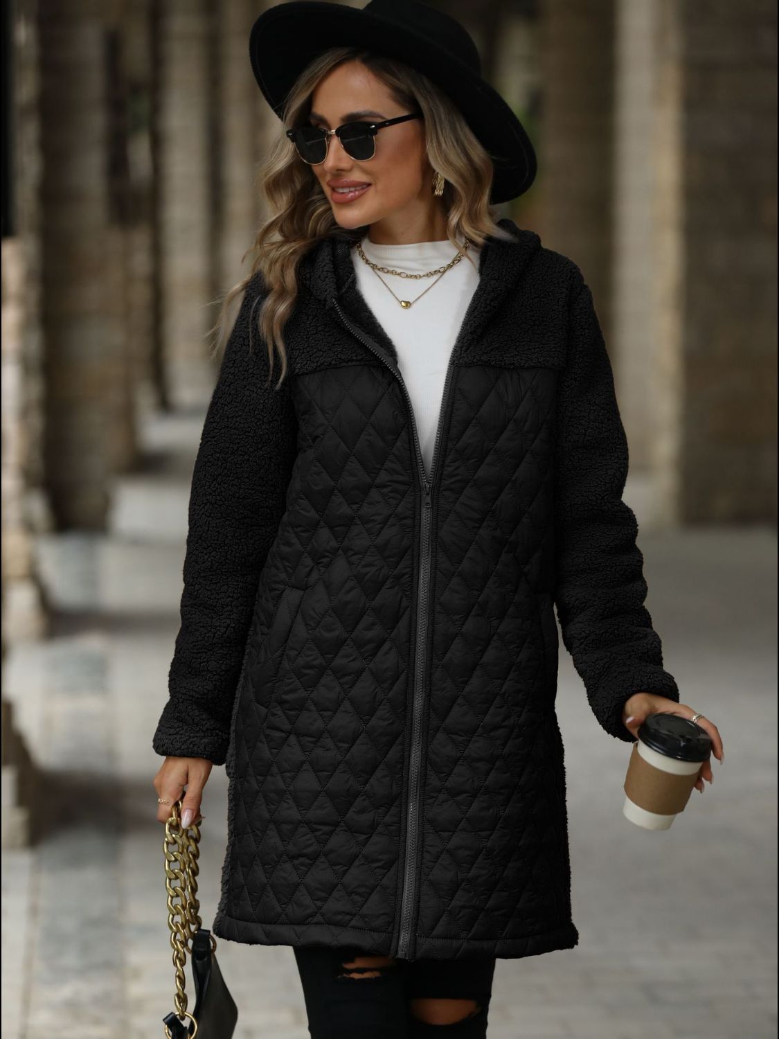Black teddy and quilted hybrid coat with hood and zipper closure