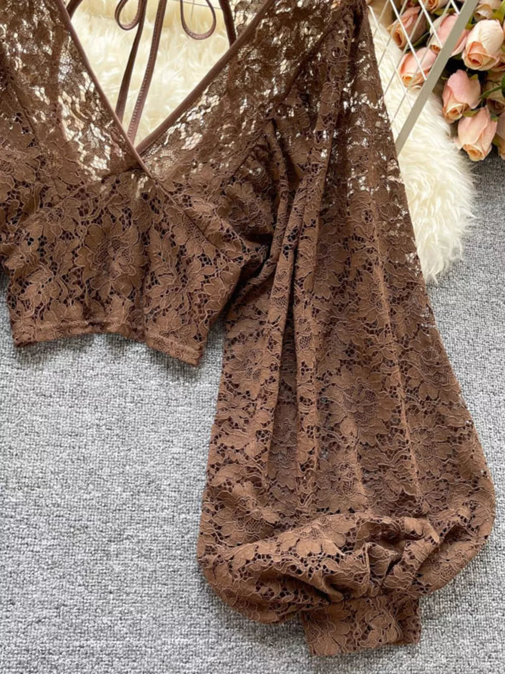 Curry floral lace cropped shirt with balloon sleeves and tie-back detail.
