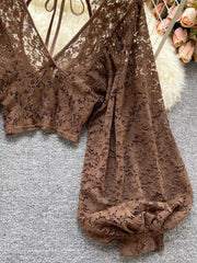 Curry floral lace cropped shirt with balloon sleeves and tie-back detail.
