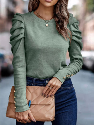 Sage knit top with ruched sleeves and gold button cuffs