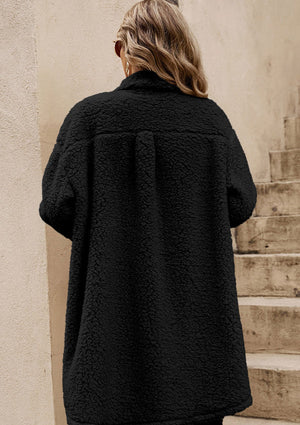 Black sherpa coat with patch pockets and a relaxed fit.