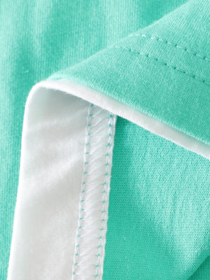 Toddler cotton set in teal with white trim and visible stitching detail.