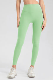 Matcha green high-waist performance leggings with sculpting seams and a full-length cut.