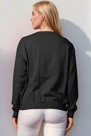 Black crewneck sweater with elasticized hem and cuffs, acrylic knit.