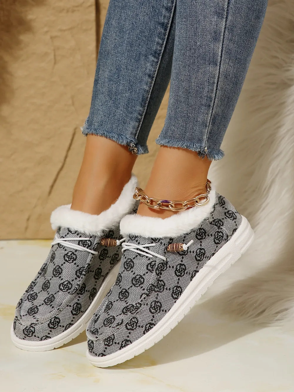 Gray Southwestern print loafers with faux fur lining and white laces.