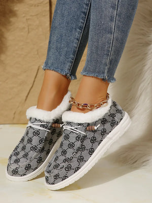 Gray Southwestern print loafers with faux fur lining and white laces.