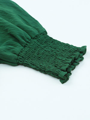 Dark green textured blouse sleeve with smocked elastic cuff and ruffled hem detail.