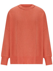 Oversized ribbed knit sweater in orange-red with drop shoulders and crew neck.
