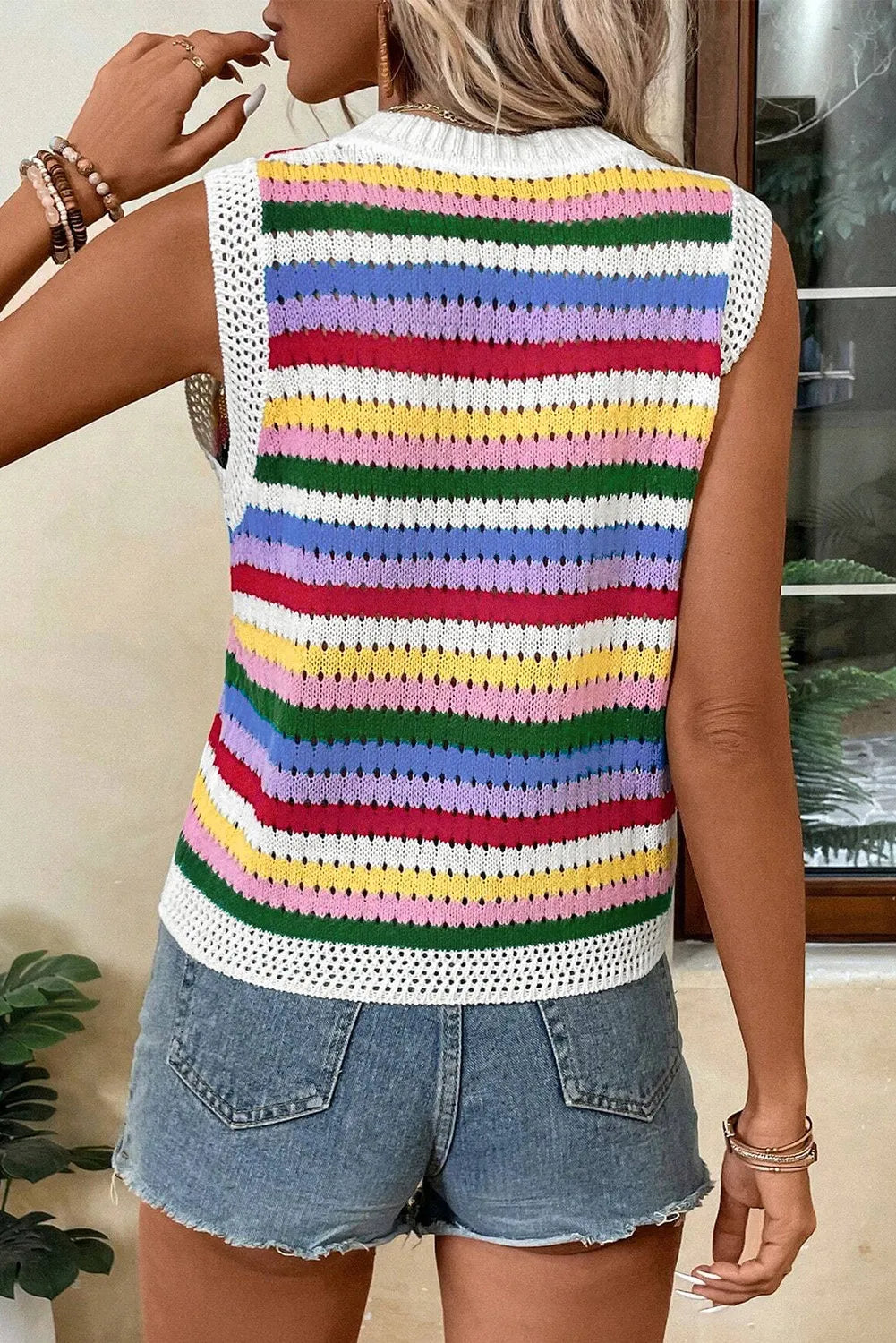 Crochet tank top with rainbow stripes and white crochet trim, sleeveless with a crew neck.