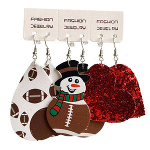 Festive sports trio earrings set with football print, snowman, and red glitter hearts.