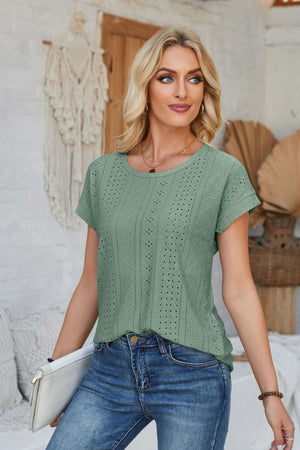 Sage green perforated eyelet t-shirt with cuffed short sleeves and a round neckline.