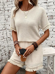Textured knit set in cream with fringe detail on short sleeves and hem.