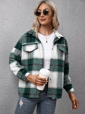 Oversized green plaid button-up shirt with white and dark green checks, featuring two chest pockets.