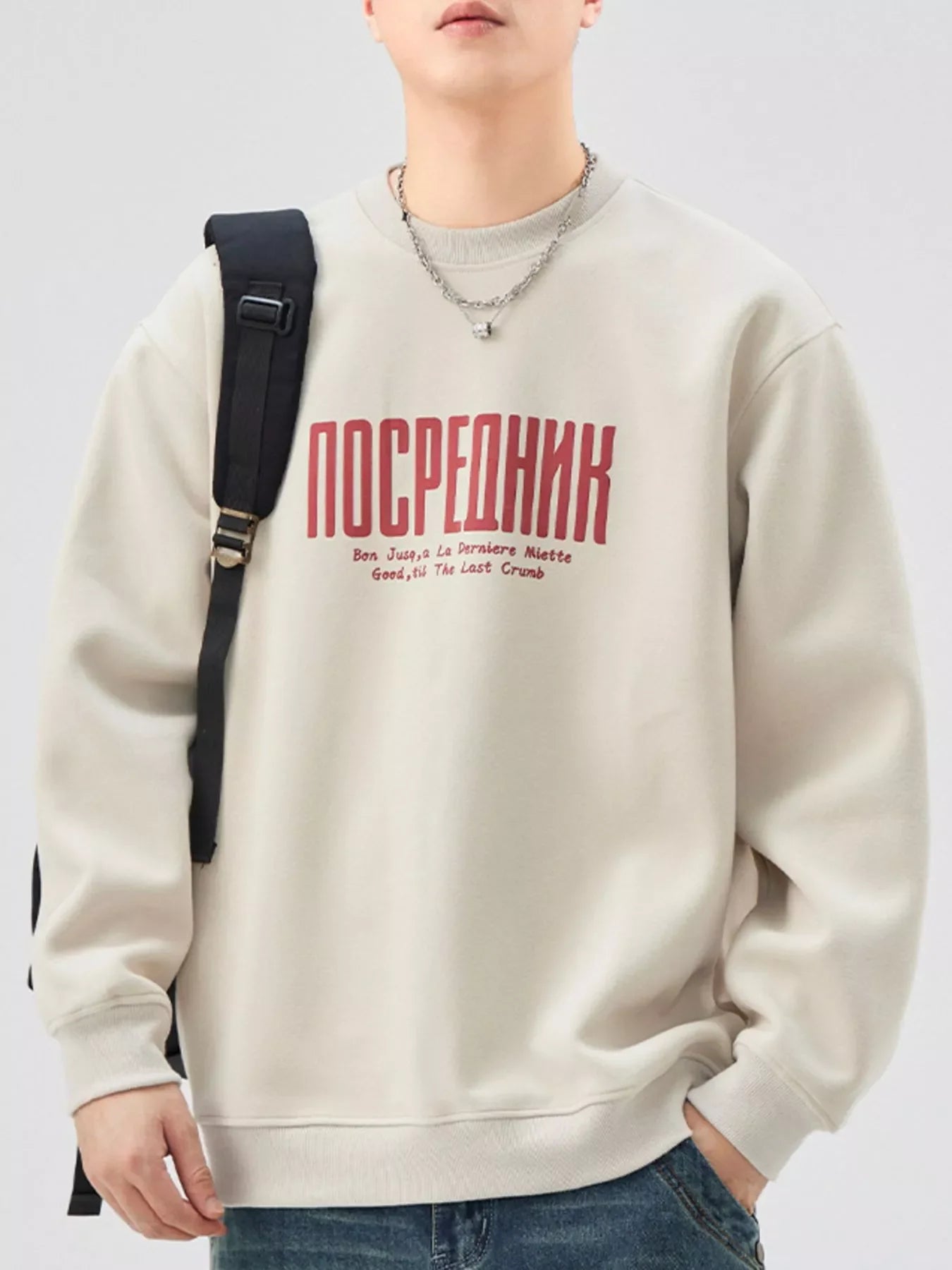 Oversized graphic sweatshirt in apricot cotton blend with red text graphic and crewneck.