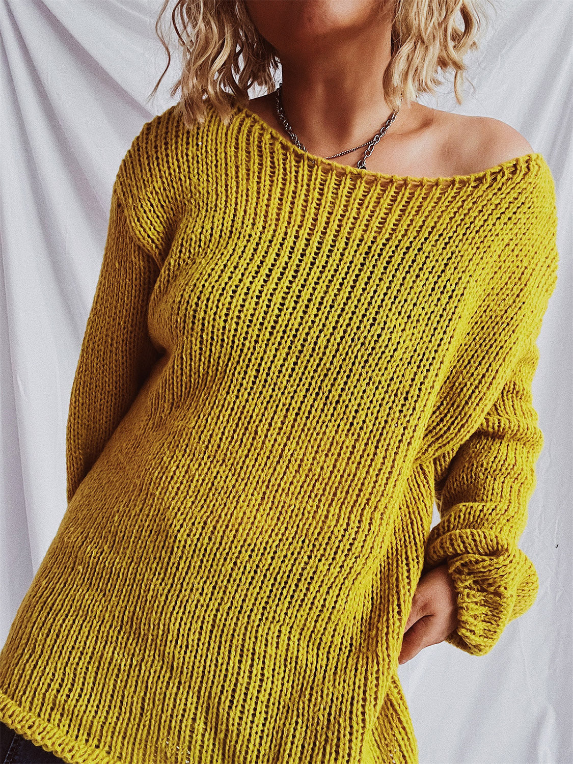 Mustard open-knit slouchy boatneck pullover sweater with a relaxed fit.