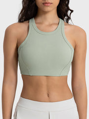 Ribbed racerback crop top in Sage with contour stitching and a high neckline.