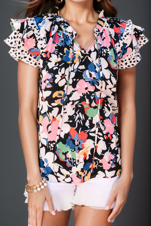 Dalmatian trim floral print blouse with tie neck and ruffled sleeves