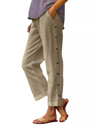 Khaki relaxed fit pants with decorative side buttons and pockets.
