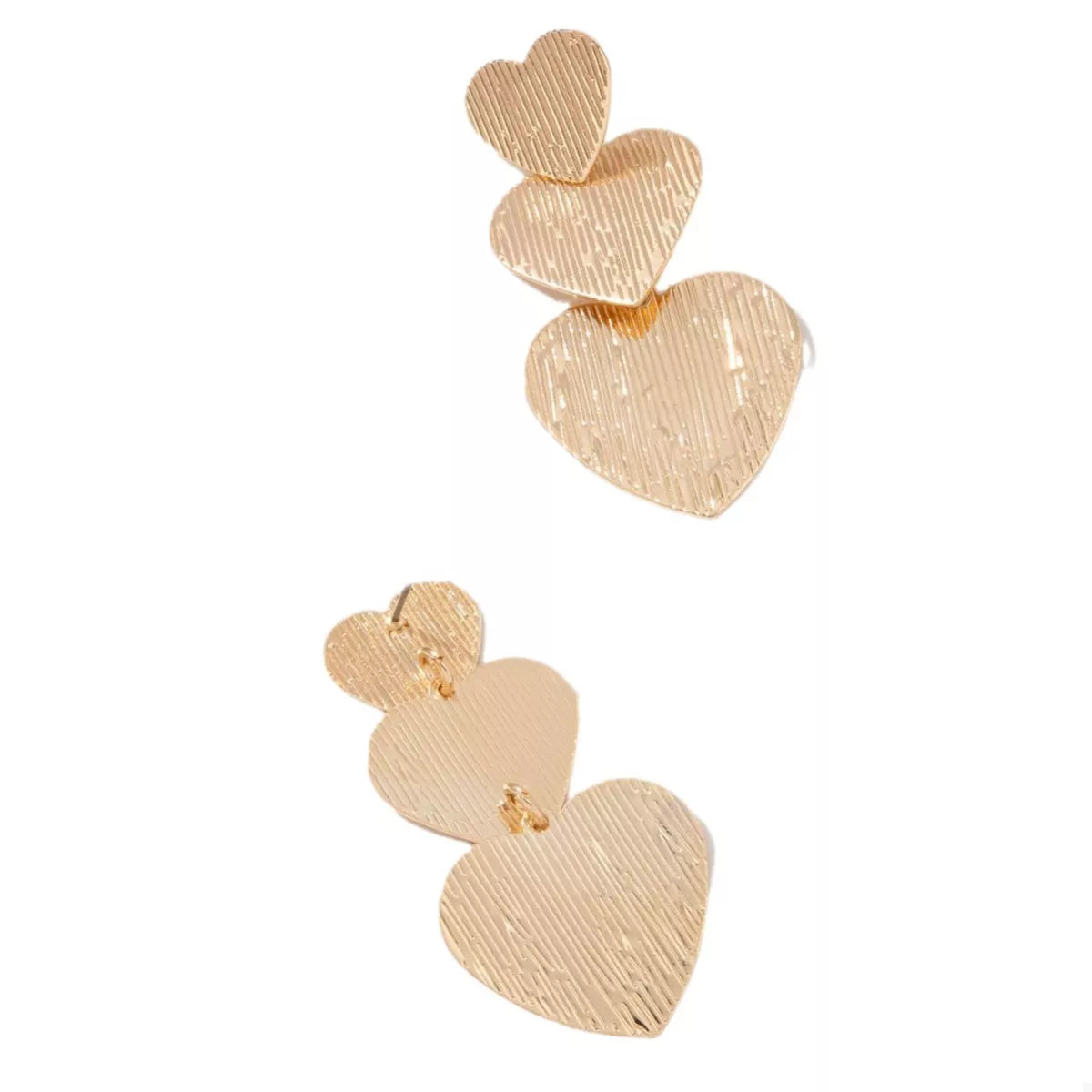 Gold heart-shaped dangle earrings with textured finish