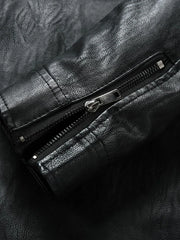 Black plus-size moto jacket with zip detail and textured faux leather.