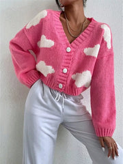 Hot pink acrylic button cardigan with white cloud pattern, V-neck, long sleeves.