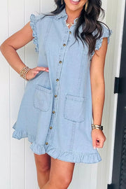 Light wash denim shift dress with ruffled collar, sleeves, and hem, button-down front, and chest pockets.