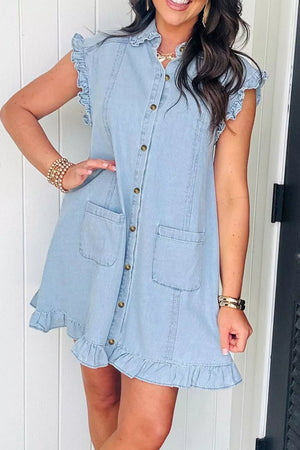 Light wash denim shift dress with ruffled collar, sleeves, and hem, button-down front, and chest pockets.